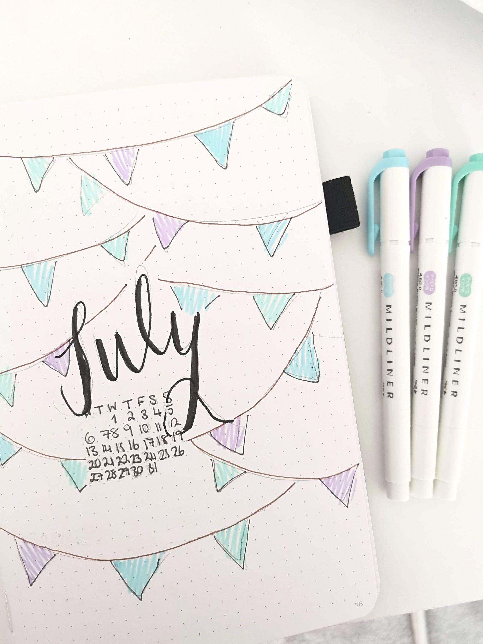 bunting-and-party-theme-july-bullet-journal-set-up-the-curious-planner